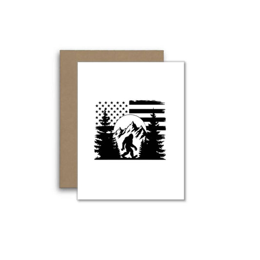 Bigfoot in Mountains with American Flag – Funny USA Card
