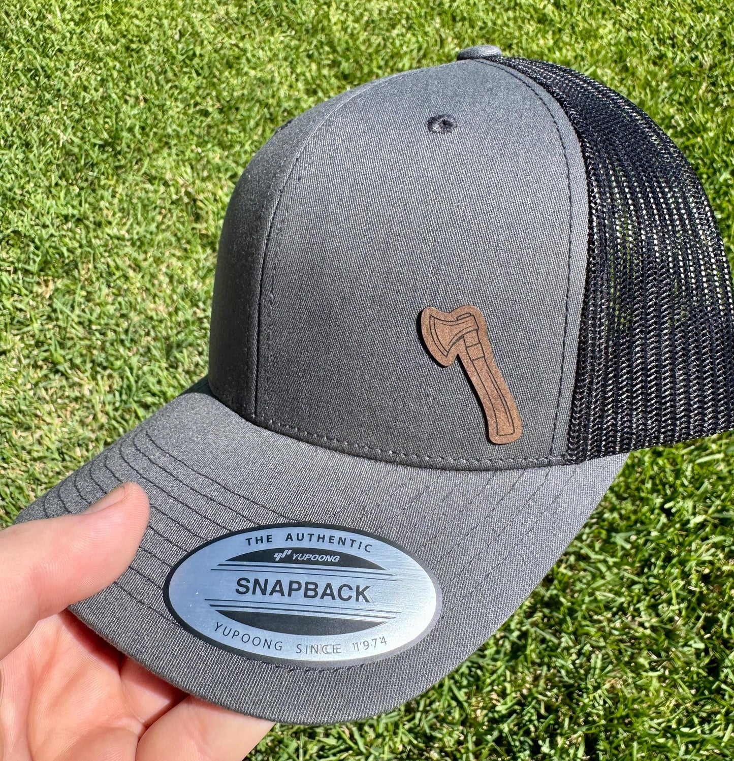 Ax Hat – Lumberjack Style Trucker or Snapback Cap – Outdoorsman Hat with Axe Design for Campers, Woodworkers, or Cabin Life