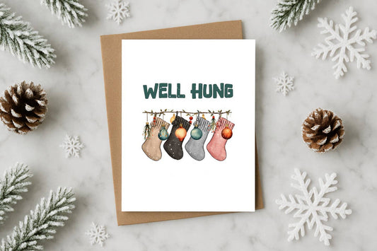 Well Hung Funny Christmas Card with Stockings – Naughty Holi
