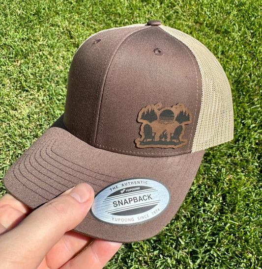 Sunset Campfire  Hat – Trucker Snapback Cap – Adirondack Chairs & Forest Scene – Outdoor Adventure Gift – Nature Lover Hat